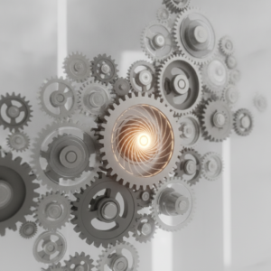 Rete stilizzata di ingranaggi interconnessi, che simboleggia la gestione di team con diversi livelli di esperienza, al centro dei corsi di formazione manager.